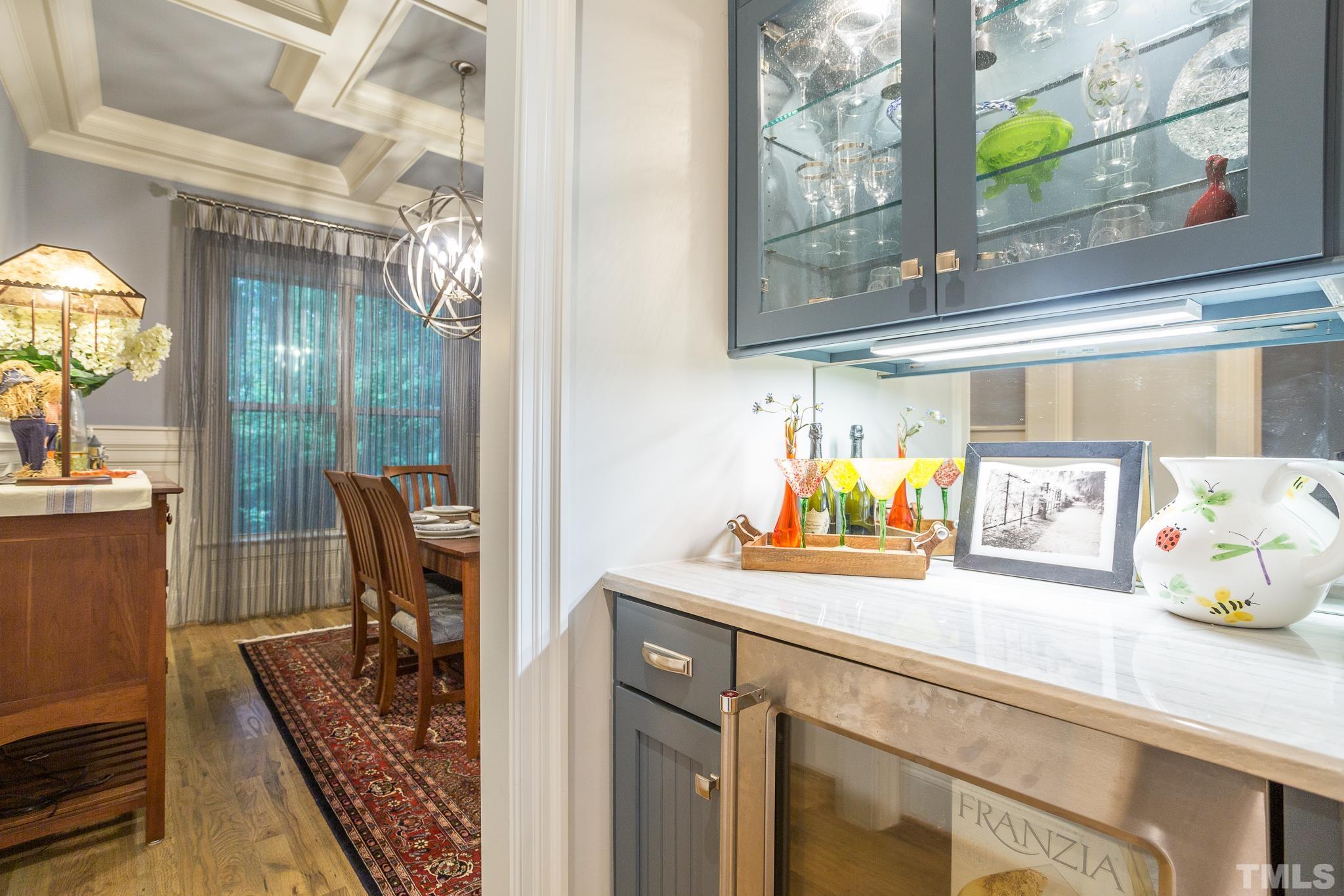 1921 Banbury Road Raleigh, NC 27608 - Photo 10 of 30 a view of a dining room with furniture and a chandelier