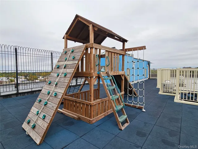 a view of staircase with living room and white walls