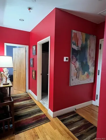 a bed room with a bed and a mirror