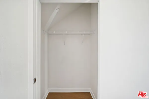 a view of a kitchen and microwave