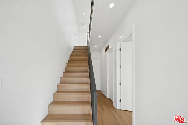 a view of entryway with wooden floor