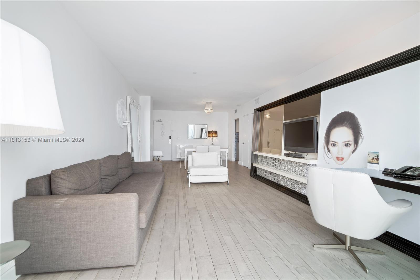 1100 West Avenue, Unit 1626 Miami Beach, FL 33139 - Photo 15 of 28 a living room with furniture and a wooden floor