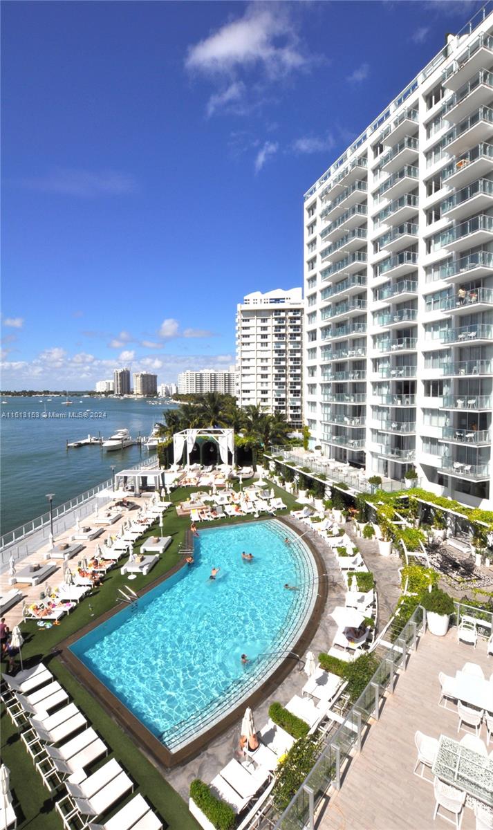1100 West Avenue, Unit 1626 Miami Beach, FL 33139 - Photo 27 of 28 a view of a swimming pool with a lounge chair