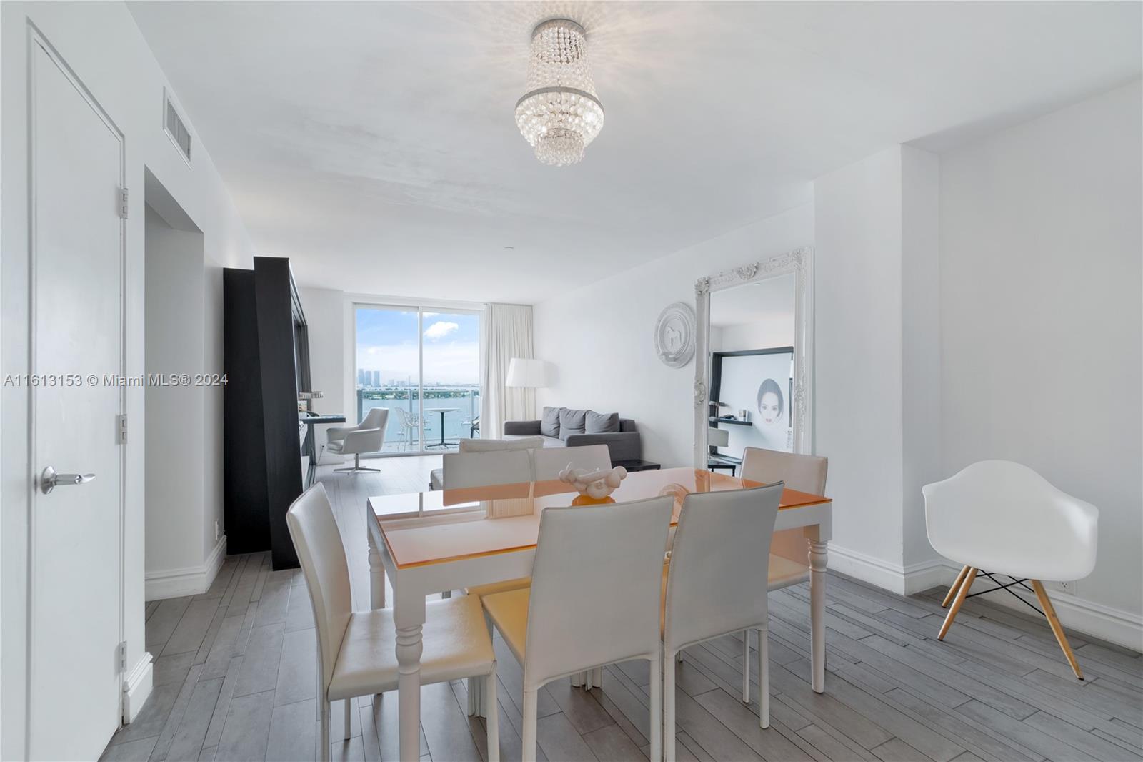 1100 West Avenue, Unit 1626 Miami Beach, FL 33139 - Photo 3 of 28 a view of a dining room with furniture and wooden floor