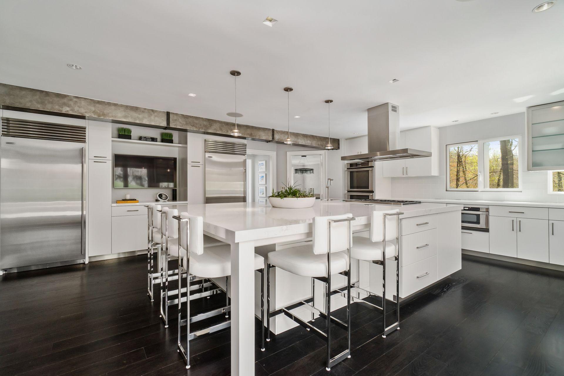 38 Farview Farm Road Redding, CT 06896 - Photo 11 of 34 a kitchen with cabinets and chairs