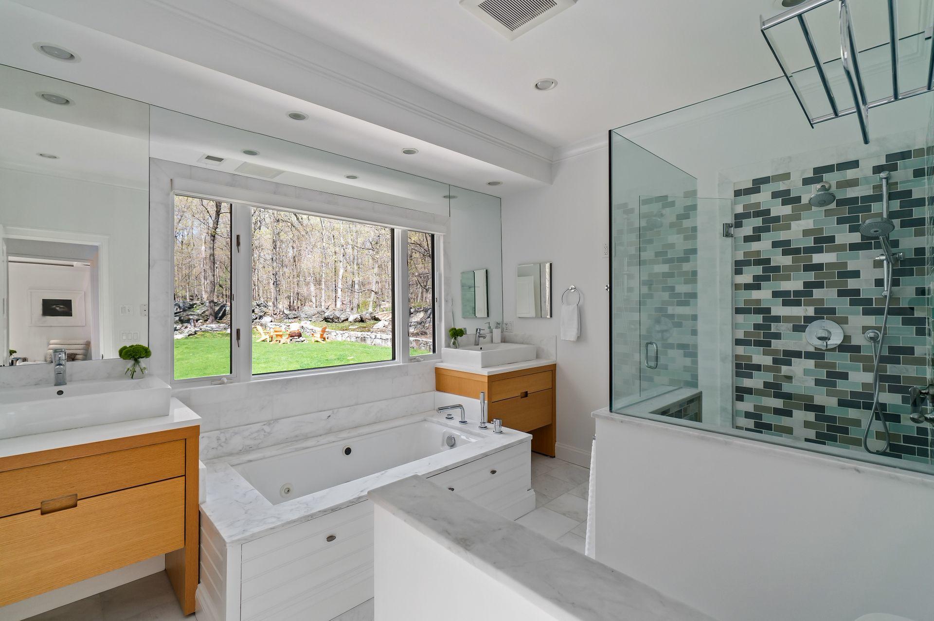 38 Farview Farm Road Redding, CT 06896 - Photo 17 of 34 a bathroom with a sink a vanity and a bathtub