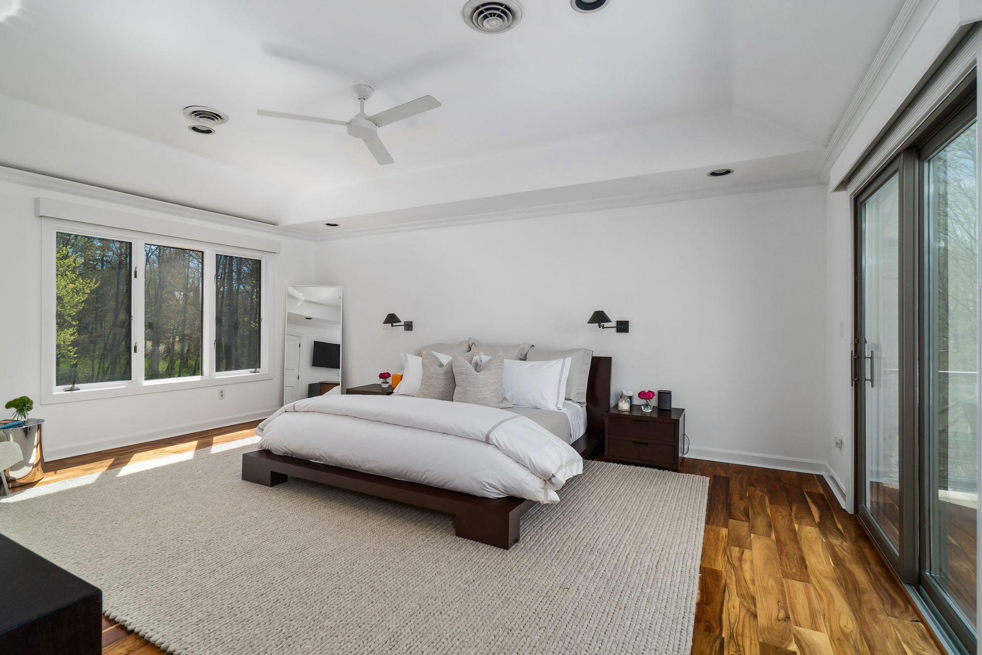 38 Farview Farm Road Redding, CT 06896 - Photo 18 of 34 a spacious bedroom with a bed and wooden floor