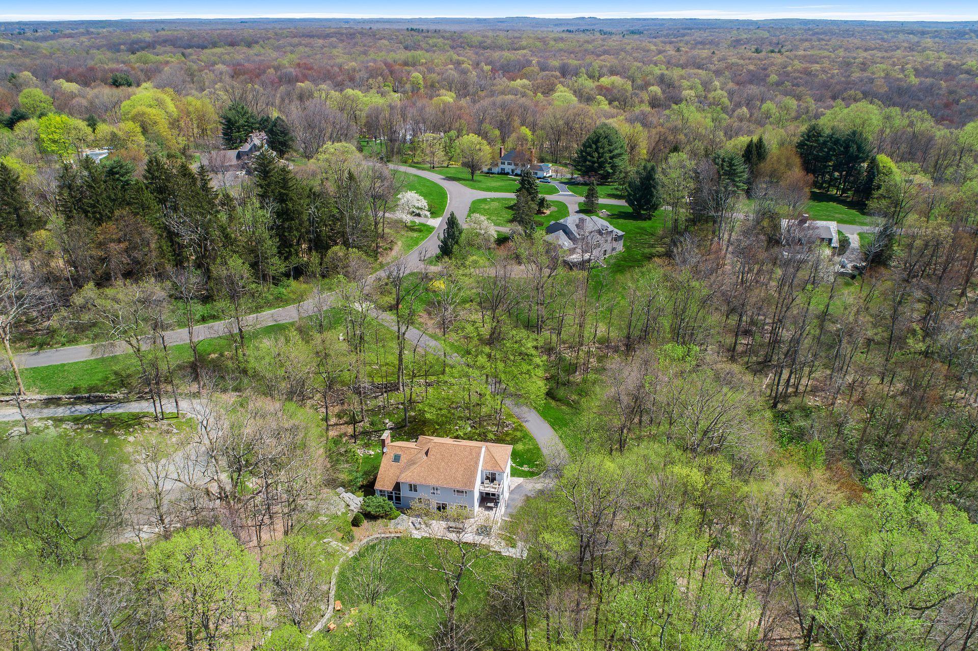 38 Farview Farm Road Redding, CT 06896 - Photo 2 of 34 a view of a city with lush green forest