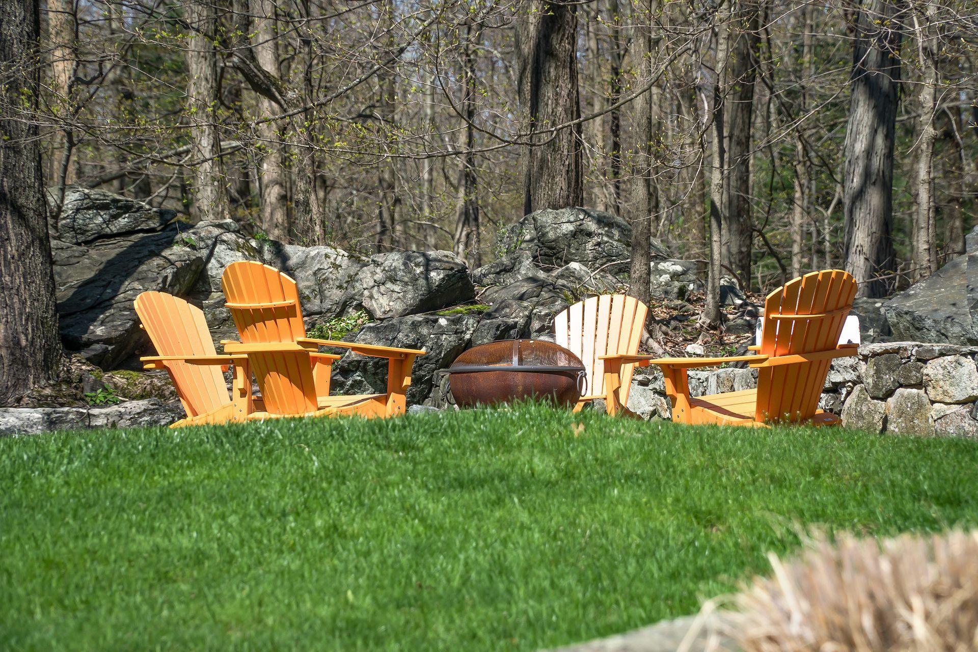 38 Farview Farm Road Redding, CT 06896 - Photo 27 of 34 a backyard of a house with table and chairs
