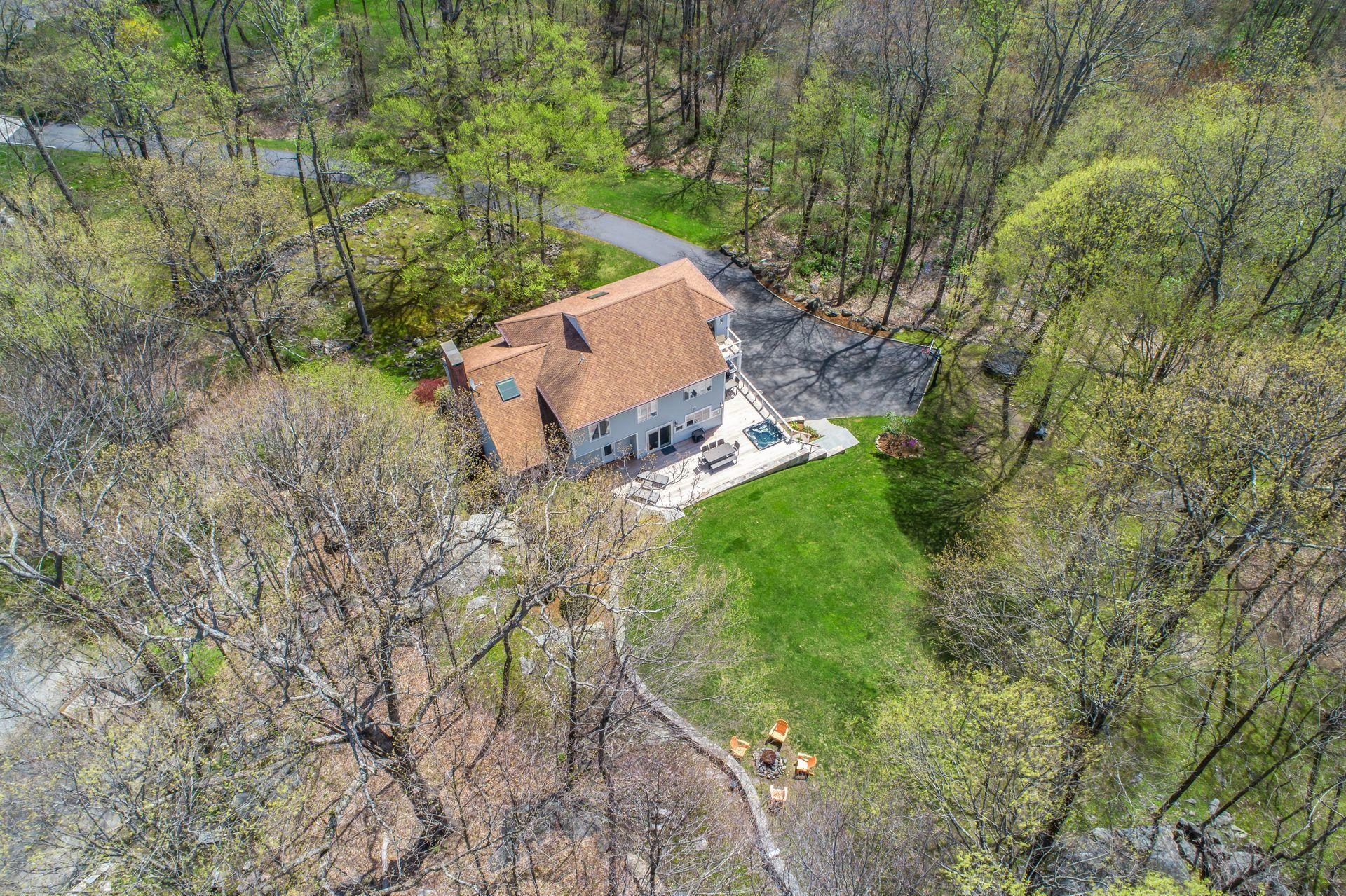 38 Farview Farm Road Redding, CT 06896 - Photo 28 of 34 an aerial view of a house with a yard and a large tree