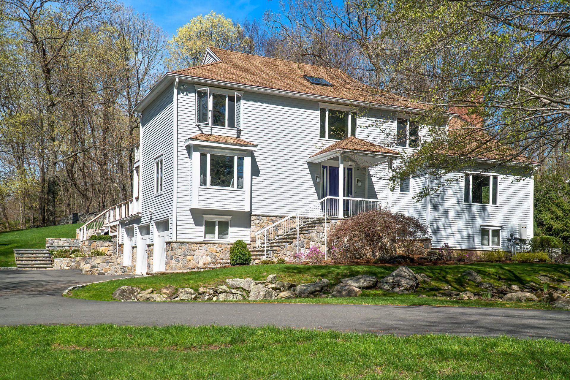 38 Farview Farm Road Redding, CT 06896 - Photo 34 of 34 a front view of a house with a garden