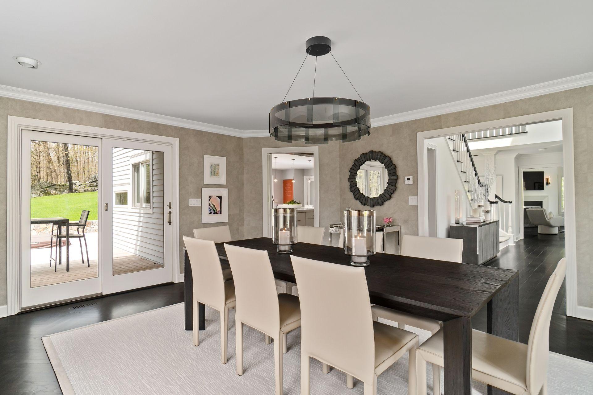 38 Farview Farm Road Redding, CT 06896 - Photo 6 of 34 a dining room with wooden floor a chandelier a wooden table and chairs