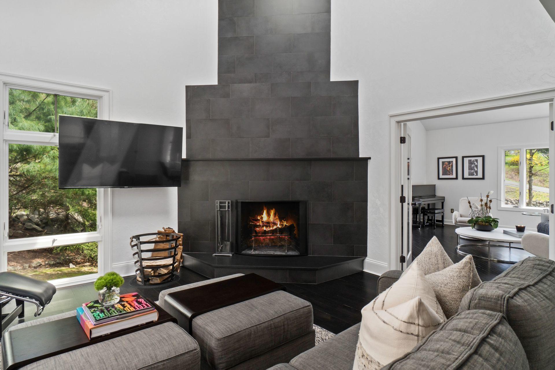 38 Farview Farm Road Redding, CT 06896 - Photo 9 of 34 a living room with furniture and a fireplace