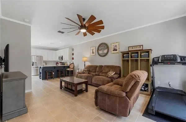 a living room with furniture and a window