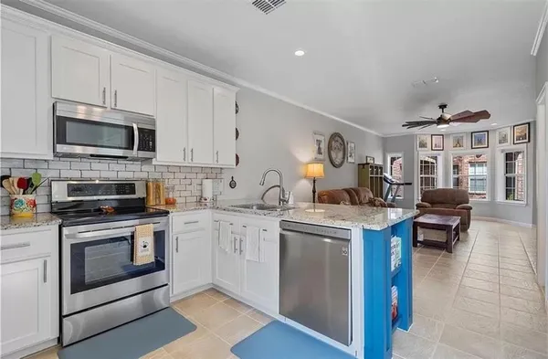 a bathroom with a toilet sink vanity and mirror