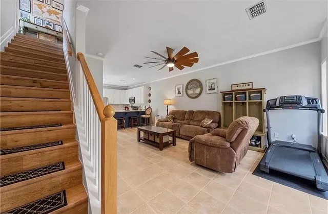 a white toilet sitting next to a bathroom sink and a mirror