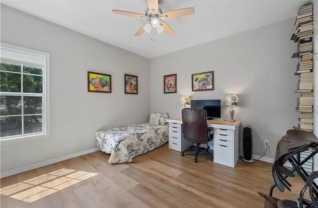 a living room with furniture and a clock