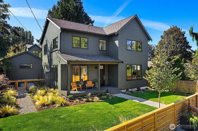 a backyard of a house with outdoor seating