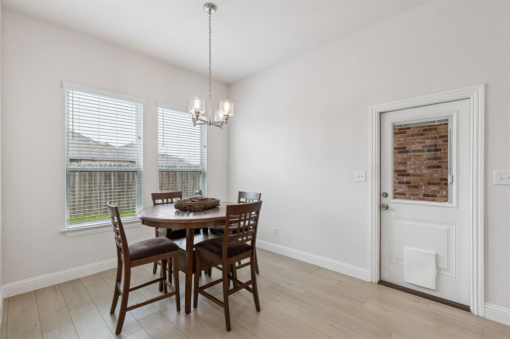 388 Montague Street Pilot Point, TX 76258 - Photo 15 of 28 a view of a dining room with furniture window and outside view