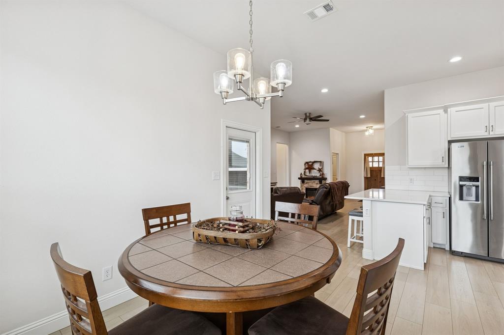 388 Montague Street Pilot Point, TX 76258 - Photo 16 of 28 a view of a dining room with furniture