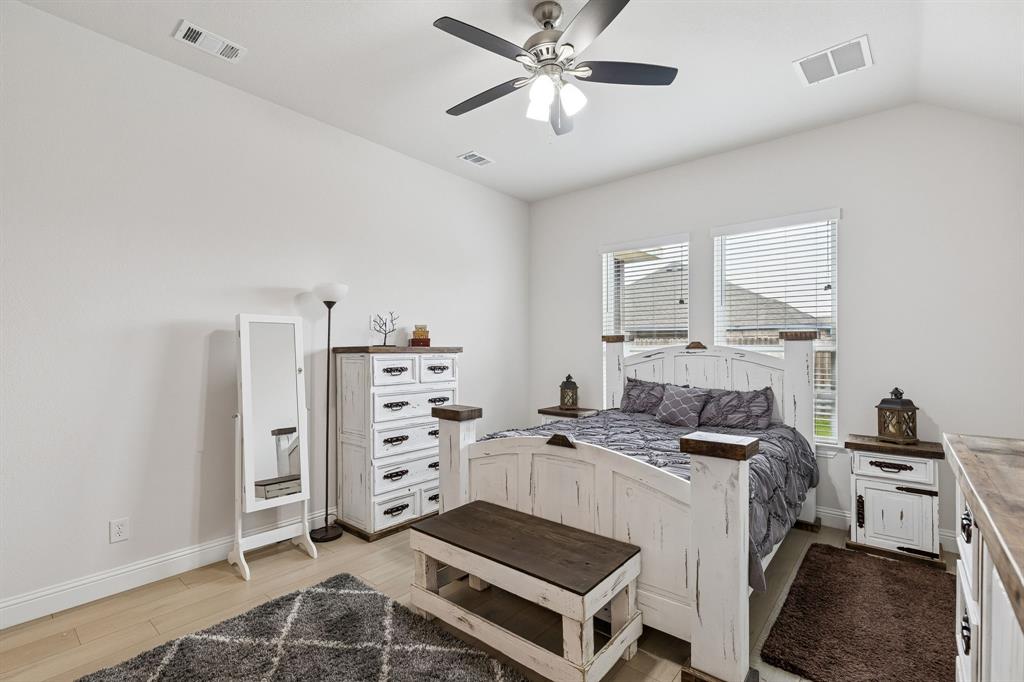388 Montague Street Pilot Point, TX 76258 - Photo 18 of 28 a kitchen that has a lot of cabinets in it