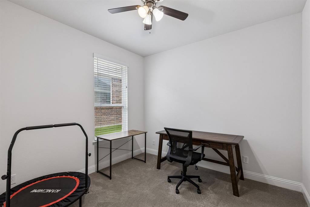 388 Montague Street Pilot Point, TX 76258 - Photo 24 of 28 a view of a workspace with furniture and a window