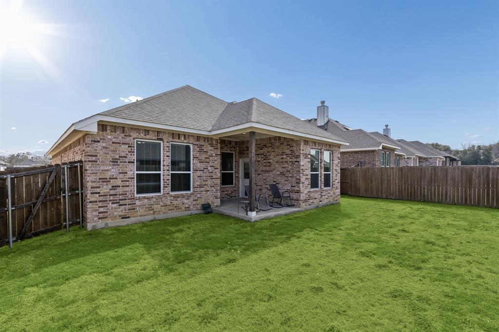 388 Montague Street Pilot Point, TX 76258 - Photo 27 of 28 a view of a house with a yard and sitting area