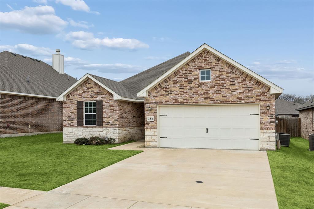 388 Montague Street Pilot Point, TX 76258 - Photo 3 of 28 a front view of house with yard