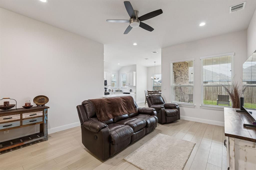 388 Montague Street Pilot Point, TX 76258 - Photo 9 of 28 a living room with furniture and a large window