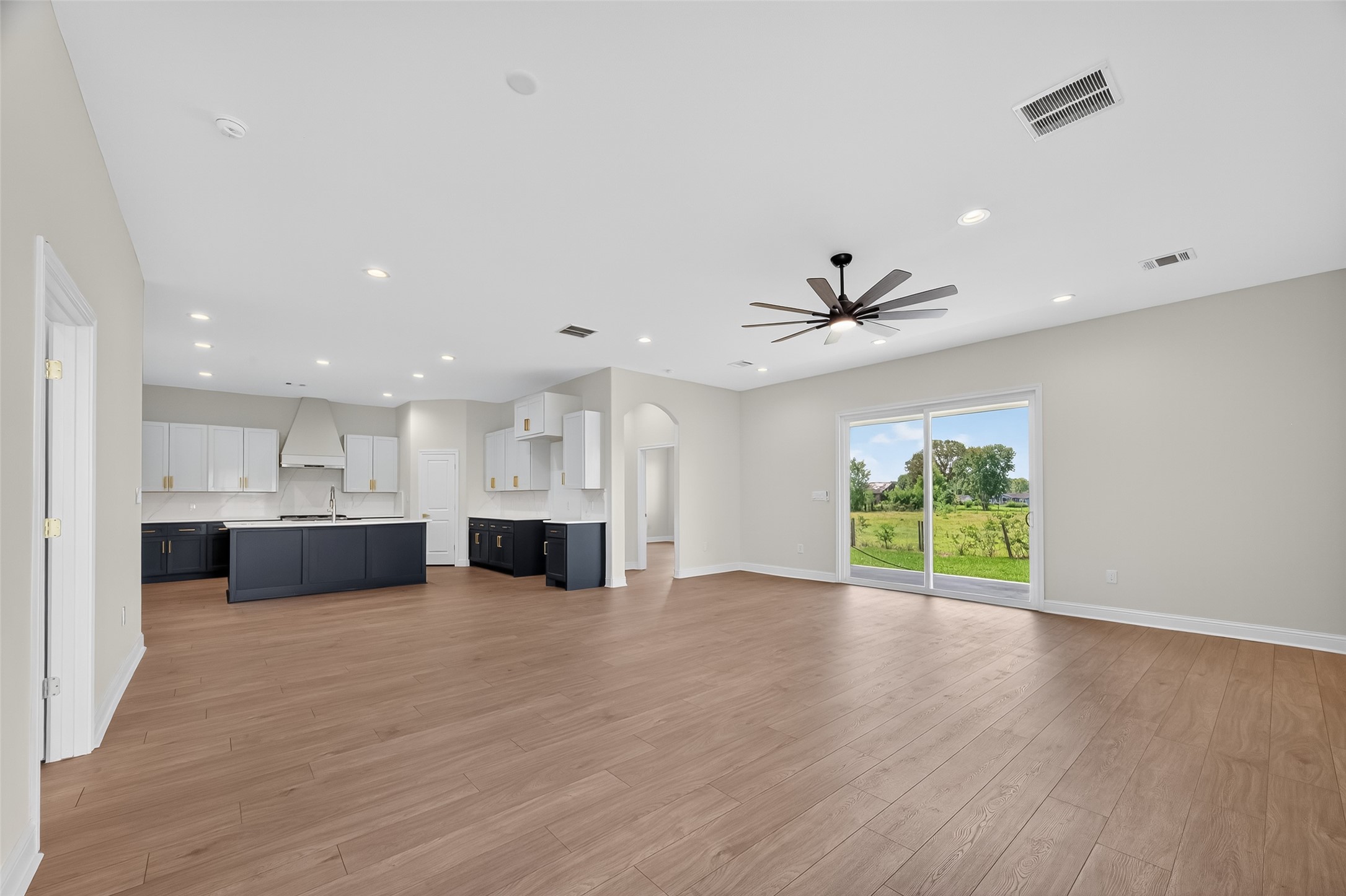 7717 Prairie Street Hitchcock, TX 77563 - Photo 12 of 43 Spacious open-concept kitchen and living area perfect for modern living.