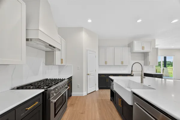 a kitchen with a sink and cabinets
