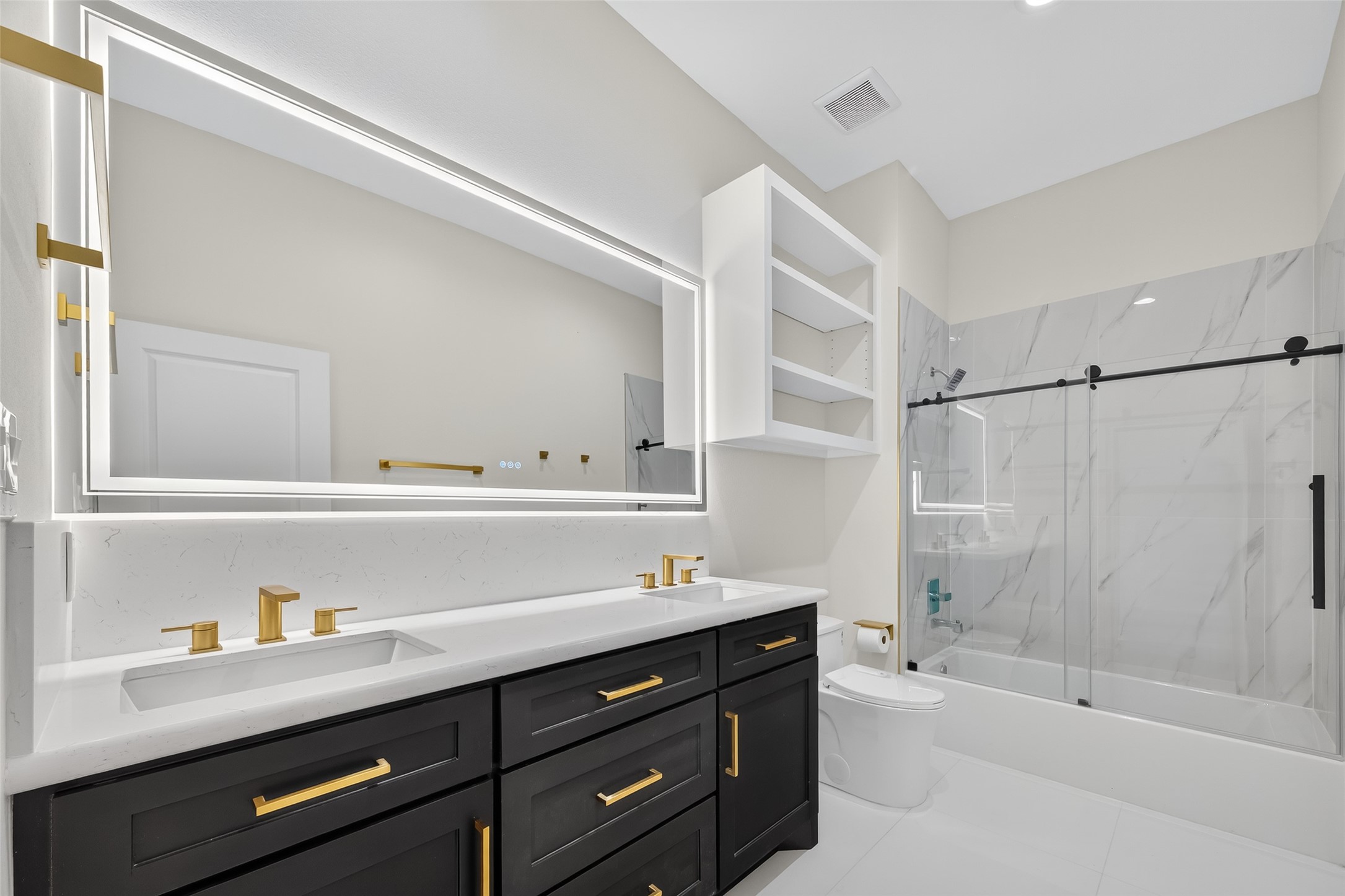 7717 Prairie Street Hitchcock, TX 77563 - Photo 24 of 43 This secondary bathroom combines functionality and elegance, featuring a luxurious LED mirror.