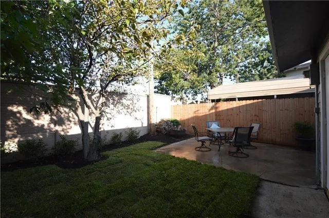 a view of outdoor space with garden and trees