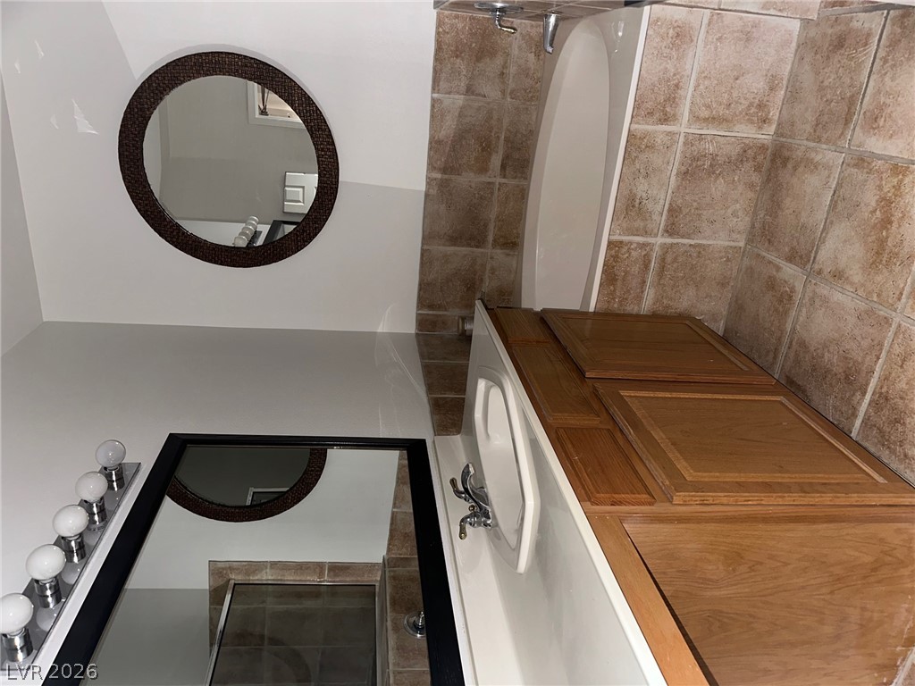 2050 West Warm Springs Road, Unit 1323 Henderson, NV 89014 - Photo 8 of 10 Functional vanity and mirror setup in this bathroom.