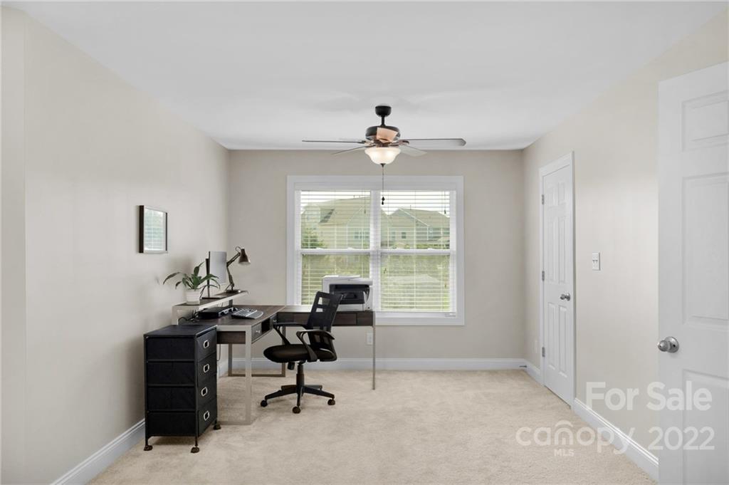 1640 Ridgehaven Road Waxhaw, NC 28173 - Photo 17 of 36 a view of a workspace with furniture and a window