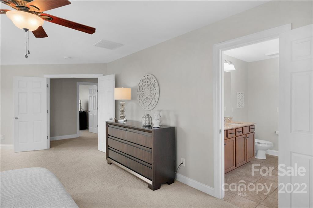 1640 Ridgehaven Road Waxhaw, NC 28173 - Photo 18 of 36 a bedroom with a bed and a dresser