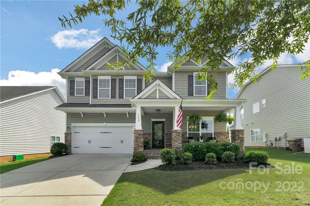 1640 Ridgehaven Road Waxhaw, NC 28173 - Photo 2 of 36 a front view of a house with garden