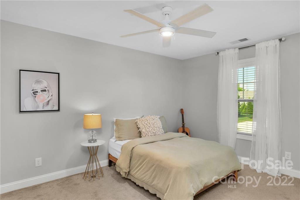 1640 Ridgehaven Road Waxhaw, NC 28173 - Photo 21 of 36 a bedroom with a bed and a window