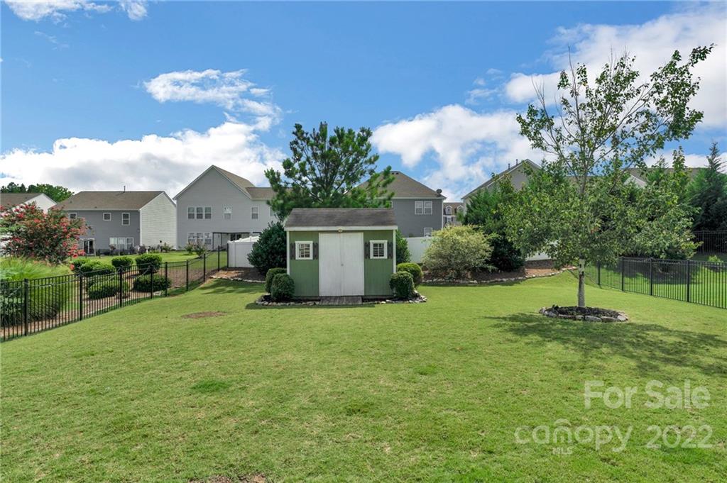 1640 Ridgehaven Road Waxhaw, NC 28173 - Photo 25 of 36 a view of a house with a backyard