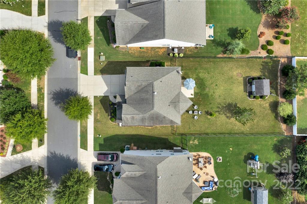 1640 Ridgehaven Road Waxhaw, NC 28173 - Photo 28 of 36 an aerial view of a house with a garden and lake view