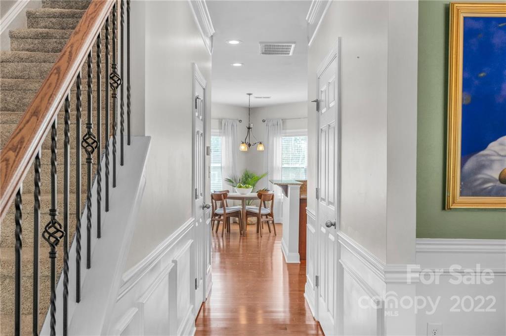 1640 Ridgehaven Road Waxhaw, NC 28173 - Photo 3 of 36 a view of a hallway with wooden floor and staircase