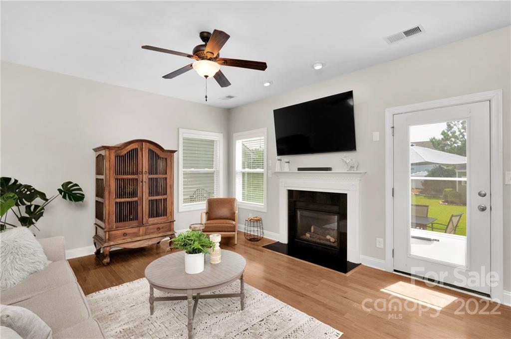 1640 Ridgehaven Road Waxhaw, NC 28173 - Photo 8 of 36 a living room with furniture a window and a fireplace