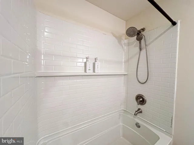 a view of an empty room and wooden floor