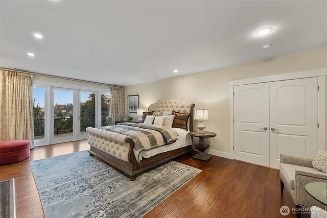 a bedroom with a bed and a painting on the wall