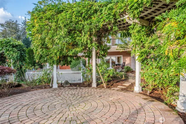 a backyard of a house with a tree