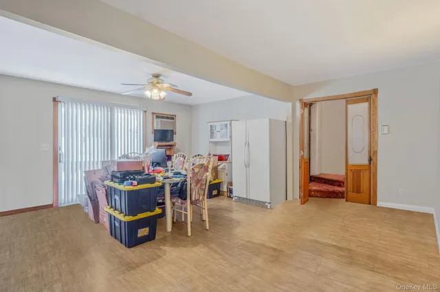 a view of a livingroom with furniture and a window