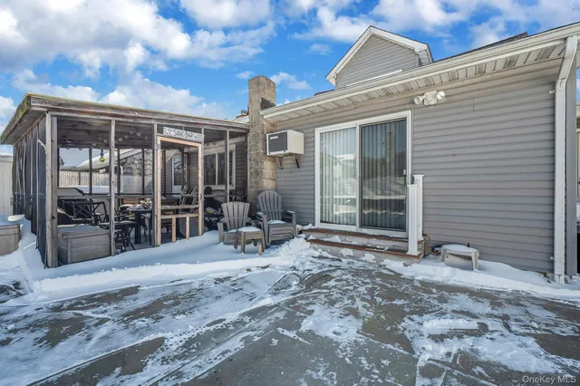 a view of a lounge chairs in the backyard