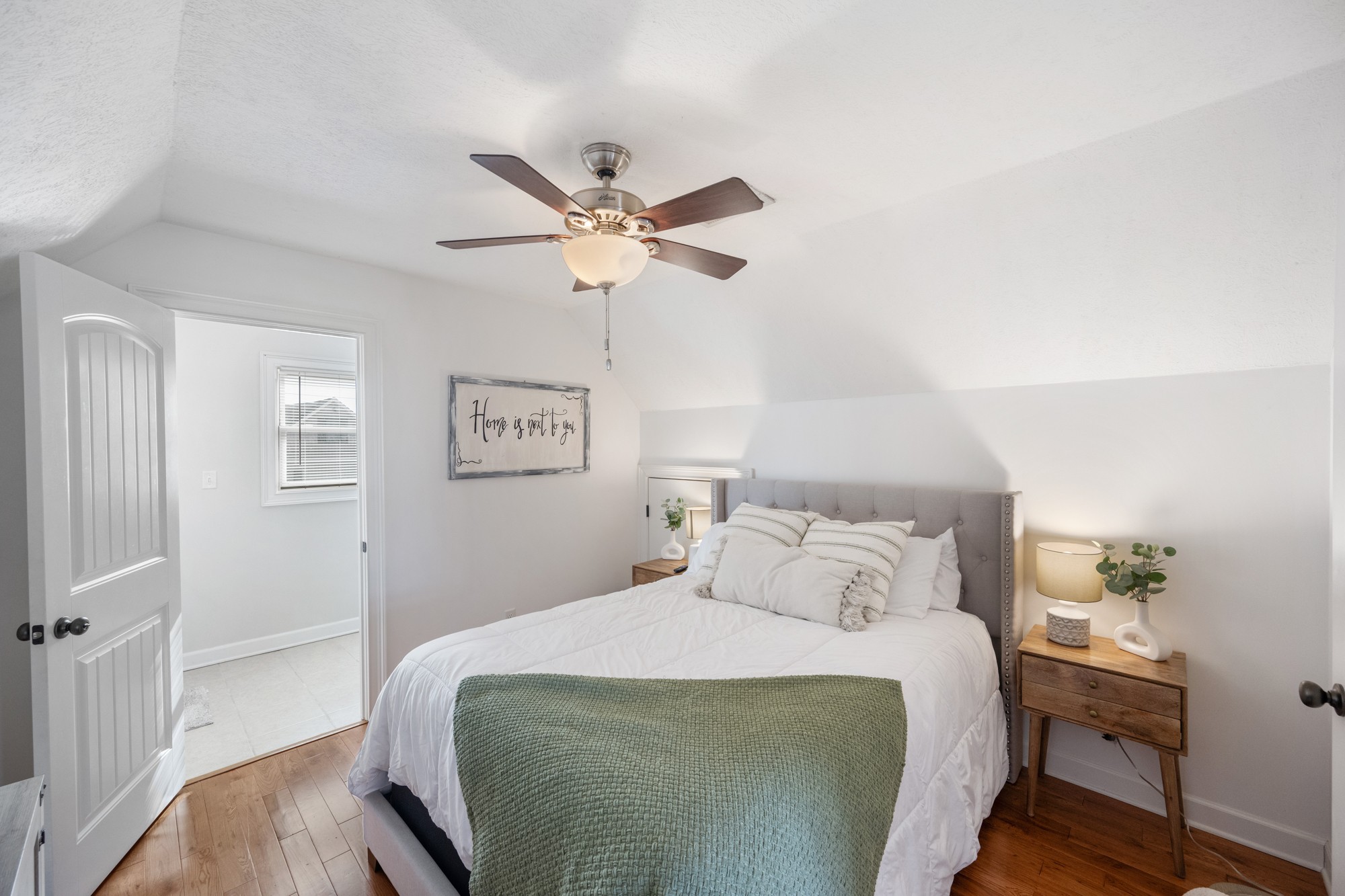 222 Fairway Villa Lane Decaturville, TN 38329 - Photo 16 of 36 a bedroom with a bed and a chandelier