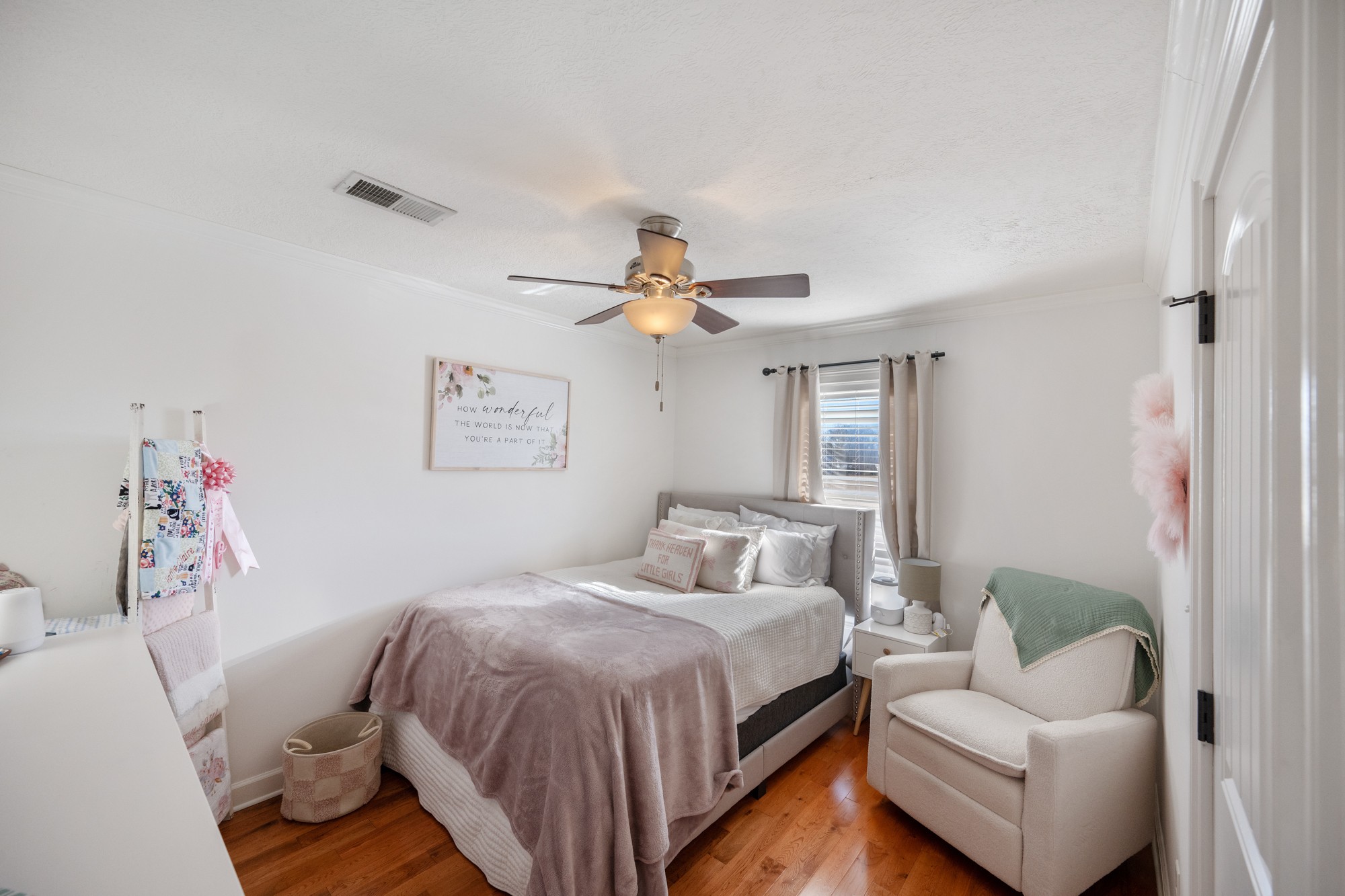 222 Fairway Villa Lane Decaturville, TN 38329 - Photo 17 of 36 a bedroom with a bed and ceiling fan