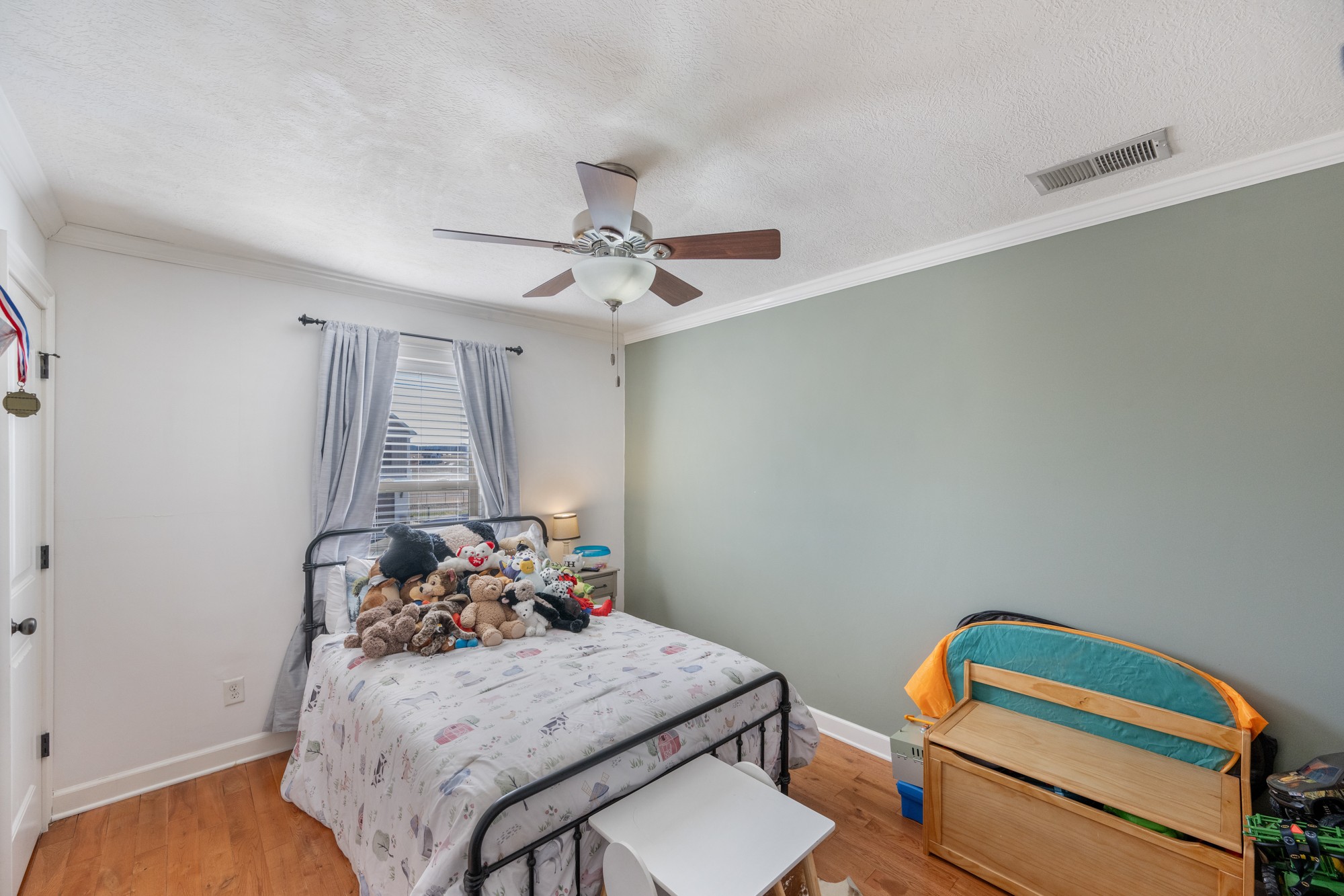 222 Fairway Villa Lane Decaturville, TN 38329 - Photo 18 of 36 a bedroom with furniture and a window